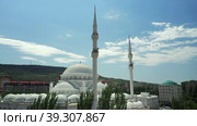 Flight orbit epic muslim central old mosque Makhachkala capital Dagestan Russia. Historical city center cityscape Majestic white domes, minarets. Beautiful epic religious temple. Road traffic. Summer. Стоковое видео, видеограф Поскребышев Михаил / Фотобанк Лори