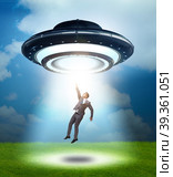 Flying saucer abducting young businessman. Стоковое фото, фотограф Elnur / Фотобанк Лори