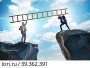 Business people helping to go over chasm. Стоковое фото, фотограф Elnur / Фотобанк Лори
