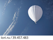 Chinese white balloon balloon, a reconnaissance or research weather probe in the sky, violated the airspace. Стоковое AI-изображение, AI-художник Владимир Разгуляев / Фотобанк Лори