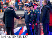 Выступление президента РФ Владимира Путина в рамках митинг-концерта "Слава защитникам Отечества", посвященного участникам спецоперации и празднованию Дня защитника Отечества на стадионе Лужники в городе Москве, Россия (2023 год). Редакционное фото, фотограф Андрей Дегтярёв / Фотобанк Лори