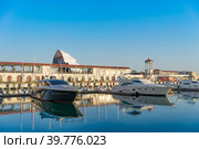 Sea port with yacht Parking on the background of the multimedia screen fanzone FIFA -2018. Редакционное фото, фотограф Виктория Кольцова / Фотобанк Лори