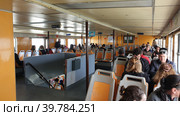Интерьер пассажирского парома. Паромная пристань Касильяс (Cacilhas ferries terminal). Алмада, Сетубал, Португалия (2023 год). Редакционное фото, фотограф lana1501 / Фотобанк Лори