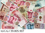 Yuan coins on heap of yuan paper money. Chinese economy and finance. Currency background. Trade relations of countries,inflation, investment, business and lending. Flat lay, closeup. Стоковое фото, фотограф Виктория Катьянова / Фотобанк Лори