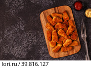 Chicken naggets with sauces on dark background. Стоковое фото, фотограф Татьяна  Бральнина / Фотобанк Лори