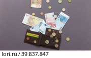 Paper euro money and euro coins go away from wallet. Concept of debt, rise in price of services and goods, loans and inflation. Cash euro finance background. Flat lay, close-up, stop motion animation. Стоковая анимация, аниматор Виктория Катьянова / Фотобанк Лори