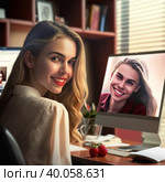 Spectacular blonde. The girl is a photographer, a retoucher works at a computer in the office. Стоковое AI-изображение, AI-художник Татьяна Бакуменко / Фотобанк Лори
