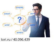 Concept of many different questions asked with businessman. Стоковое фото, фотограф Elnur / Фотобанк Лори
