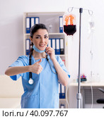 Young female doctor in infusion concept. Стоковое фото, фотограф Elnur / Фотобанк Лори