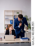 Boss and young female secretary in remuneration concept. Стоковое фото, фотограф Elnur / Фотобанк Лори