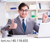 Businessman with paper airplane in office. Стоковое фото, фотограф Elnur / Фотобанк Лори