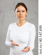 Portrait of displeased adult woman posing in studio. Стоковое фото, фотограф Яков Филимонов / Фотобанк Лори