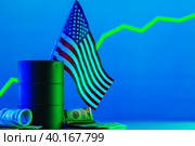 Price of american oil is changing concept. Black barrel with oil and graph. Стоковое фото, фотограф Сергей Толмачёв / Фотобанк Лори