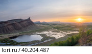 Panorama panoramic landscape nature mountains sunrise sunset of Chest butte or First Sunduk against blue sky. Sunduki mountain range from Devonian sandstone stone located in the valley of the Bely Iyus River in Khakassia, Russia. Стоковое фото, фотограф Владимир Разгуляев / Фотобанк Лори
