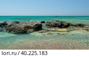 Water moving in the blue lagoon of Elafonisi beach with pink sand and black rocks. Crete. Greece (2023 год). Стоковое видео, видеограф Сергей Пристяжнюк (Serg Zastavkin) / Фотобанк Лори
