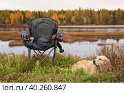 Tourist collapsible chair on the background of the autumn landscape. Стоковое фото, фотограф Александр Поташев / Фотобанк Лори