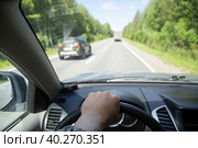 Overtaking a car.A dangerous maneuver on the road.Driving a car. Стоковое фото, фотограф Александр Поташев / Фотобанк Лори