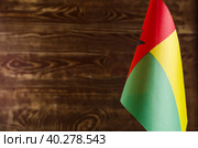Фрагмент флага Республики Гвинея-Бисау на цветном деревянном фоне место для текста (2019 год). Стоковое фото, фотограф Лозовая Людмила / Фотобанк Лори