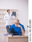 Two male doctors radiologists working in the clinic. Стоковое фото, фотограф Elnur / Фотобанк Лори