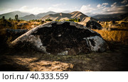 Rock painting aka petroglyphs at the field in Cholpon-Ata, Issyk-kul, Kyrgyzstan (2016 год). Стоковое фото, фотограф Сергей Майоров / Фотобанк Лори