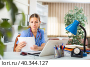 Young female doctor working in her office. Стоковое фото, фотограф Яков Филимонов / Фотобанк Лори