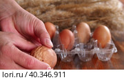 Close-up view of a deformed chicken egg. An ugly abnormal crooked egg compared to the right one. Lack of trace elements in the body of old chickens. Стоковое видео, видеограф Александр Кротков / Фотобанк Лори