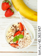 Traditional healthy Breakfast. Natural yogurt with strawberries, banana and chocolate. Selective focus. Стоковое фото, фотограф Виктория Панченко / Фотобанк Лори