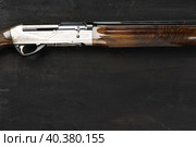 Smoothbore hunting gun on black background close up. Стоковое фото, фотограф Сергей Толмачёв / Фотобанк Лори