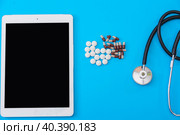 Tablet tablet pills and stethoscope on a blue background. Стоковое фото, фотограф Ярославский Максим / Фотобанк Лори