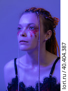 Cinematic night portrait of woman face with shiny make-up with sequins illuminated neon light. Стоковое фото, фотограф А. А. Пирагис / Фотобанк Лори