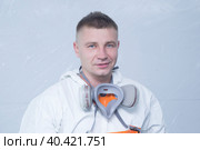 Portrait of a car mechanic. An auto mechanic is engaged in painting cars. Стоковое фото, фотограф Александр Поташев / Фотобанк Лори