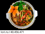 Vietnamese fried Mackerel fish with sauce on black background. Стоковое фото, фотограф Татьяна Терехина / Фотобанк Лори
