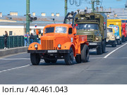 SAINT PETERSBURG, RUSSIA - MAY 20, 2023: Technological tractor assembled from two Soviet trucks of the ZiL-164 and MAZ-200 is the head of a convoy of trucks on the retrotransport parade. International Transport Festival SPb TransportFest. Редакционное фото, фотограф Виктор Карасев / Фотобанк Лори
