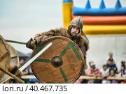 Russia, Staraya Ladoga 23,06,2012 Reenactors with shields and spears during the battle, the festival of historical reconstruction "Pages of History" Стоковое фото, фотограф Анна Кривицкая / Фотобанк Лори