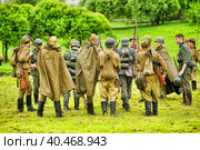 Soldiers in military uniform of the second world war at the historical reconstruction to the Day of the Border Guard. Стоковое фото, фотограф Анна Кривицкая / Фотобанк Лори