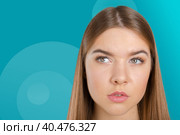 Thinking woman standing pensive contemplating looking skeptic. Стоковое фото, фотограф Сергей Толмачёв / Фотобанк Лори