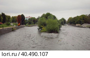 Stormy course of the Terek River in Vladikavkaz. Urban landscape. Стоковое видео, видеограф Юрий Поздников / Фотобанк Лори