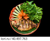 Vietnamese fried fish with rice, greens and vegetables on black background. Стоковое фото, фотограф Татьяна Терехина / Фотобанк Лори