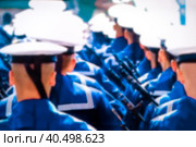 Sailors in white peakless caps march in formation at the Victory Parade, rear view, blurred focus. Стоковое фото, фотограф Коханова Наталья / Фотобанк Лори
