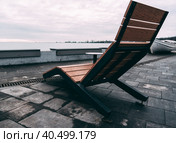 empty sun lounger on the seashore on evening at sunset. Стоковое фото, фотограф Артем Курутин / Фотобанк Лори