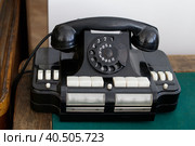 An old Soviet office telephone with Russian letters on a wooden table. Стоковое фото, фотограф Ирина Кононова / Фотобанк Лори