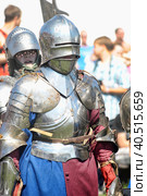 Knight in a helmet and armor at the historical reconstruction of the "Altar City" (2012 год). Редакционное фото, фотограф Анна Кривицкая / Фотобанк Лори