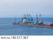 View of the pier of the Korsakov Sea Trade Port on Sakhalin Island. (2019 год). Редакционное фото, фотограф Ирина Кононова / Фотобанк Лори