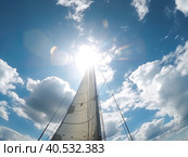 Luxury yachts on a sailing regatta. The bright sun is at its zenith. Sailing in the wind through the waves at sea. Bottom view from. Created by Ai. Стоковое AI-изображение, AI-художник Ярославский Максим / Фотобанк Лори