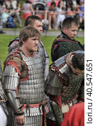 Knights in military uniforms at the Festival of the historical reconstruction of the Middle Ages "Vyborg Castle" (2014 год). Редакционное фото, фотограф Анна Кривицкая / Фотобанк Лори