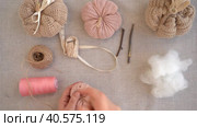 Making interior pumpkins from textiles, knitted fabric, alterations from an old sweater, hobbies, diy. Crafts for Thanksgiving. Стоковое видео, видеограф Ирина Старикова / Фотобанк Лори