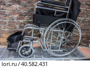 Folded wheelchair. Public toilet. Стоковое фото, фотограф Iva Noel / Фотобанк Лори