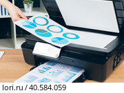 Female secretary making photocopies on xerox machine in office. Стоковое фото, фотограф Сергей Толмачёв / Фотобанк Лори