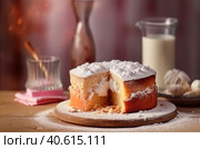 Biscuit cake with powdered sugar and a glass of milk. Generative AI. Стоковое AI-изображение, AI-художник Юрий Поздников / Фотобанк Лори