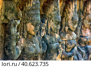 Apsara carved on the wall of the Elephant terrace, Angkor Thom. cambodia. (2017 год). Редакционное фото, фотограф Анна Кривицкая / Фотобанк Лори